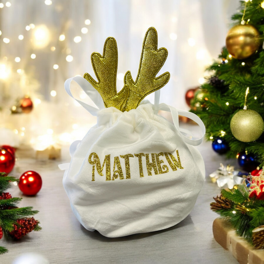 Gold and white reindeer ear gift bag